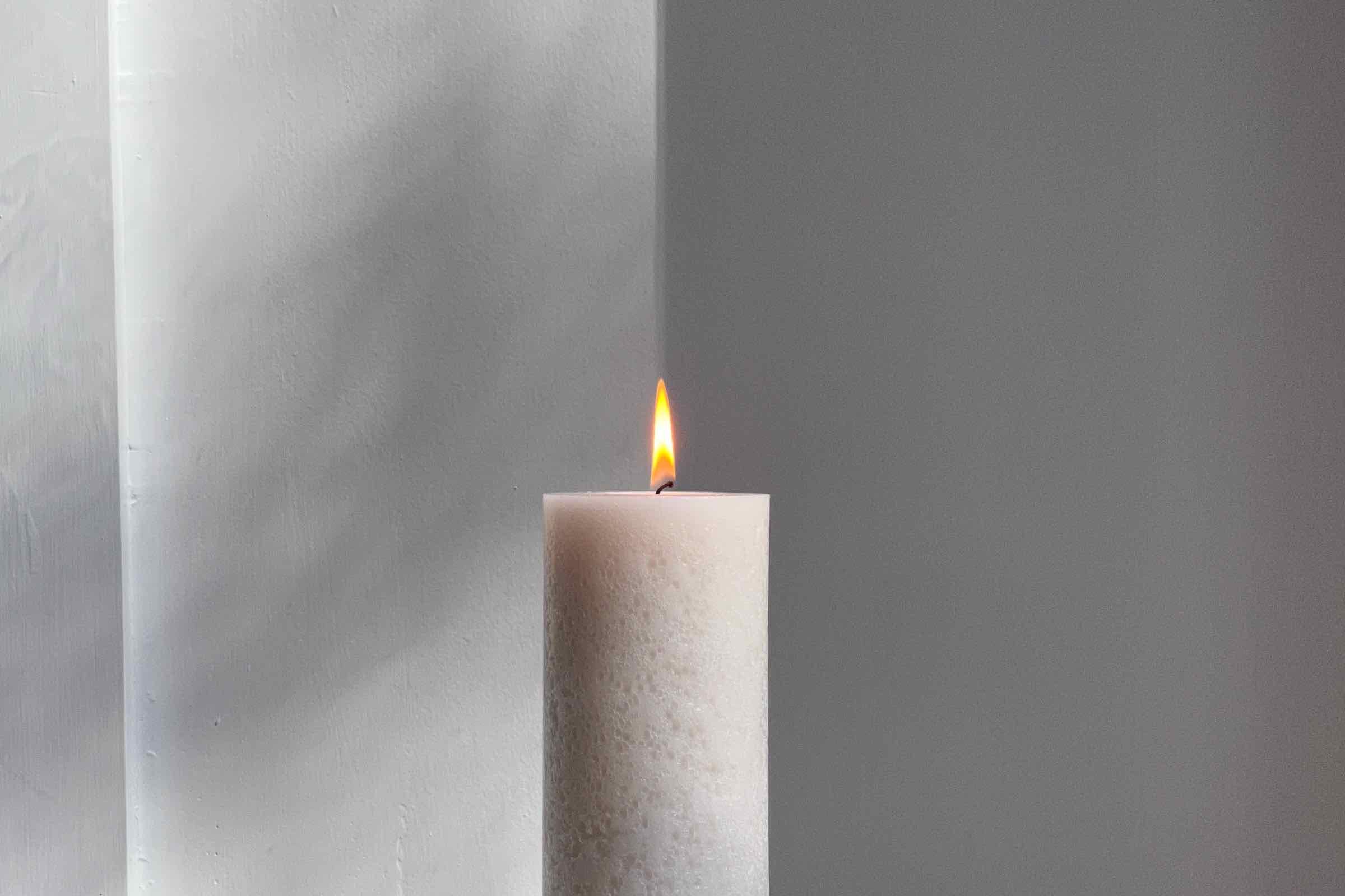 visible light - Why is the bottom part of a candle flame blue