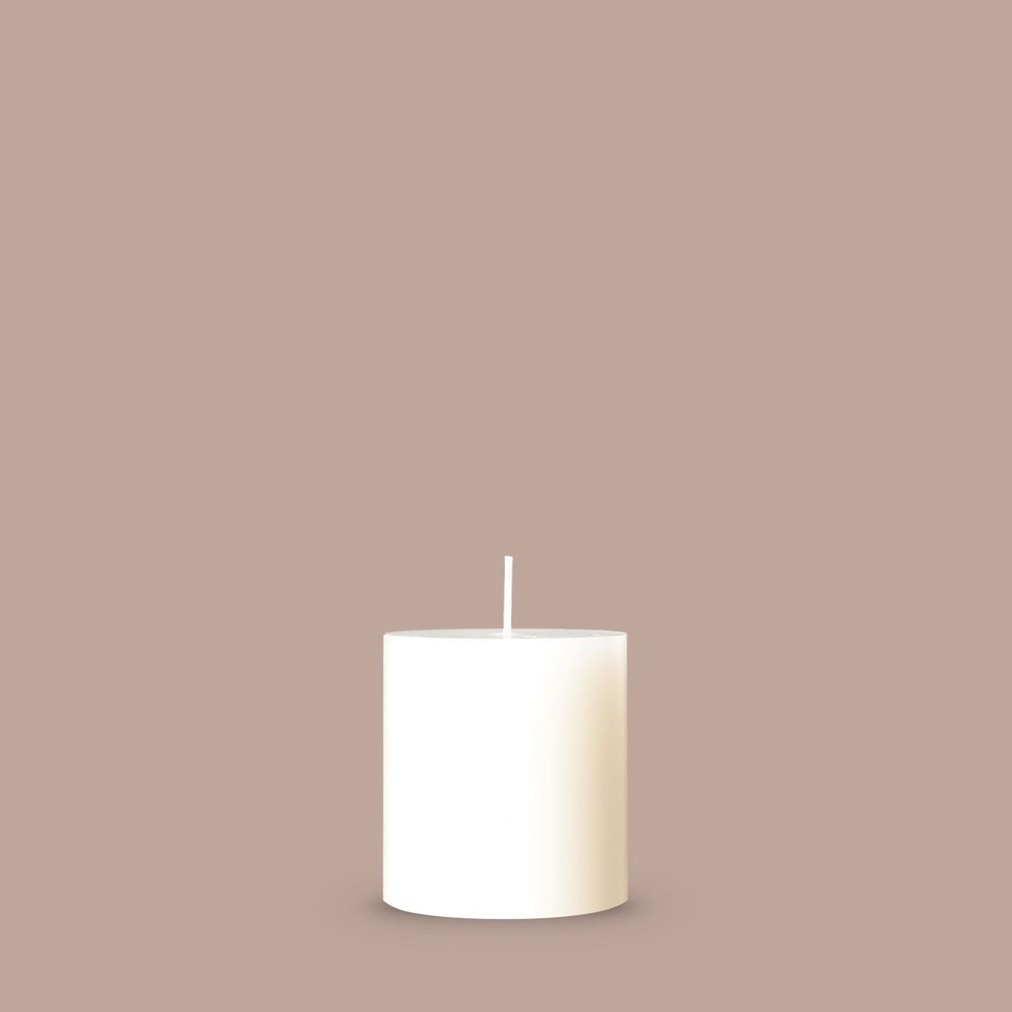 Small white pillar candle