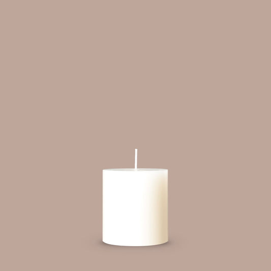 Small white pillar candle