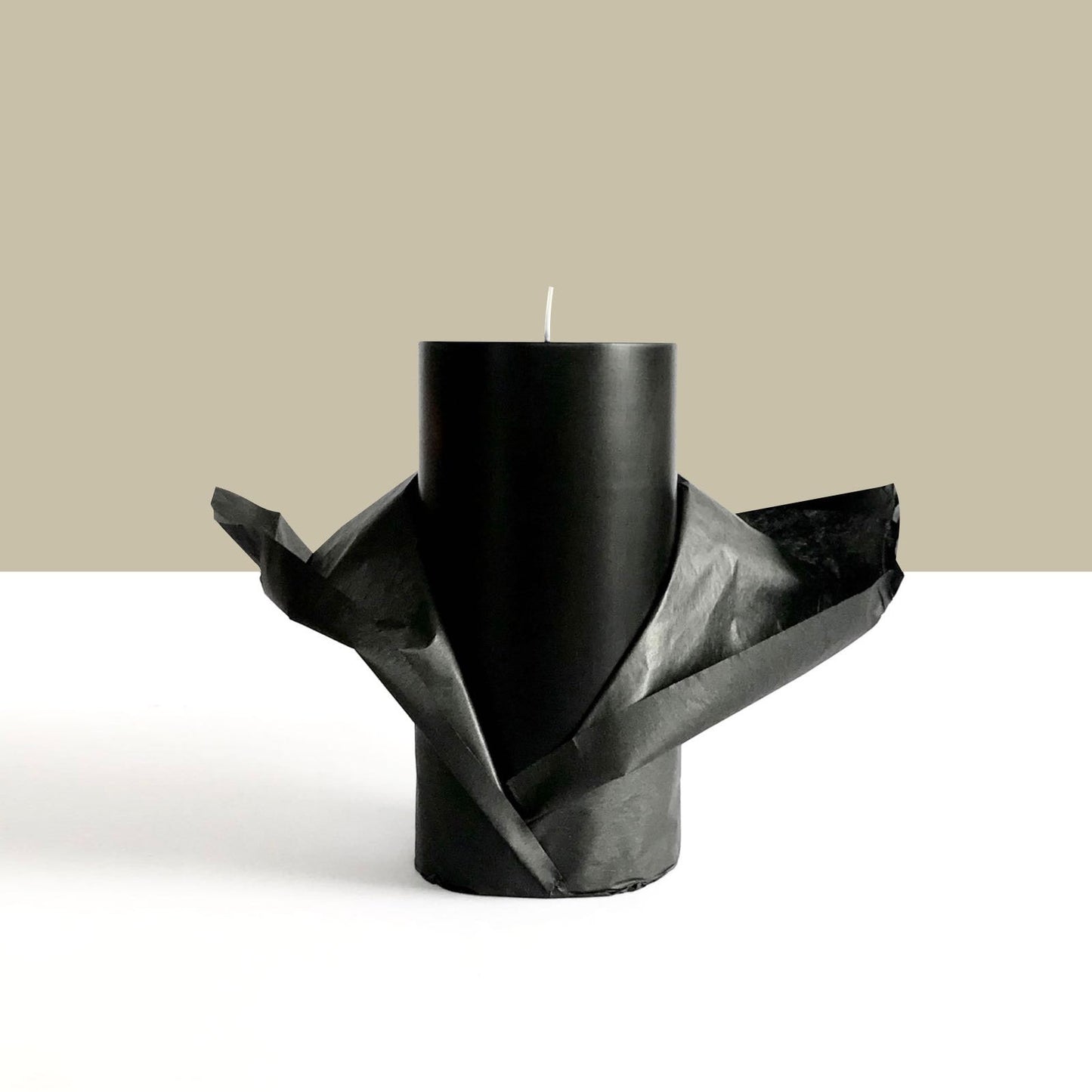 Black pillar candle wrapped