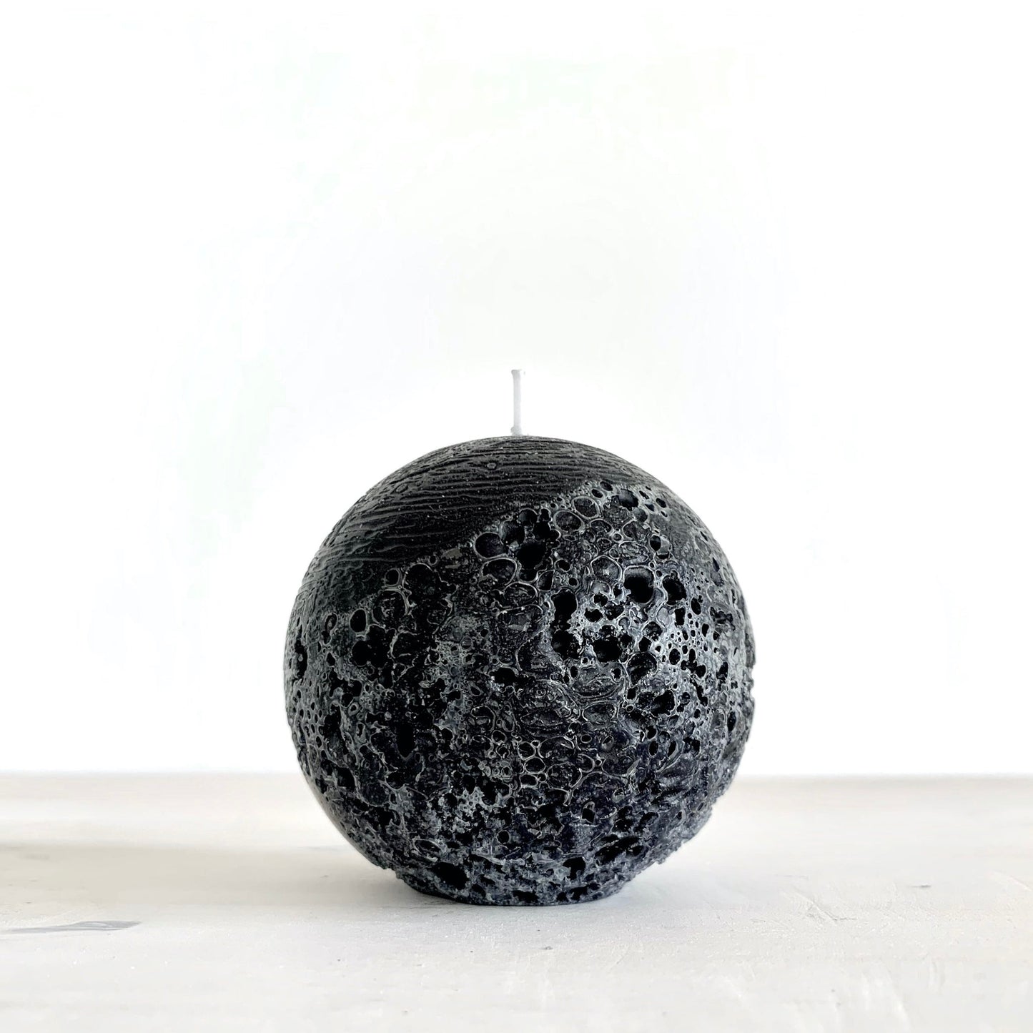 Round black candle