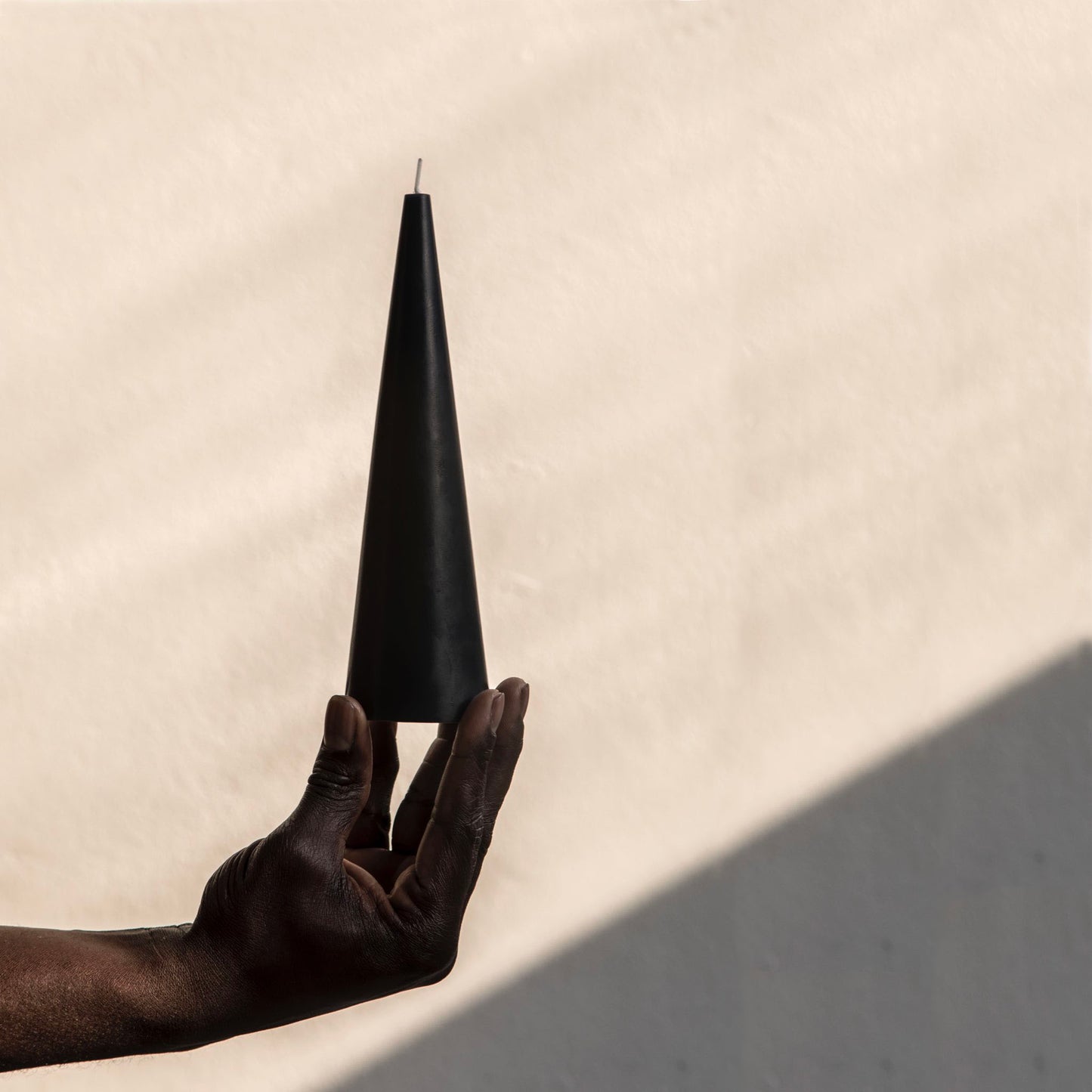 Sculptural black cone candle