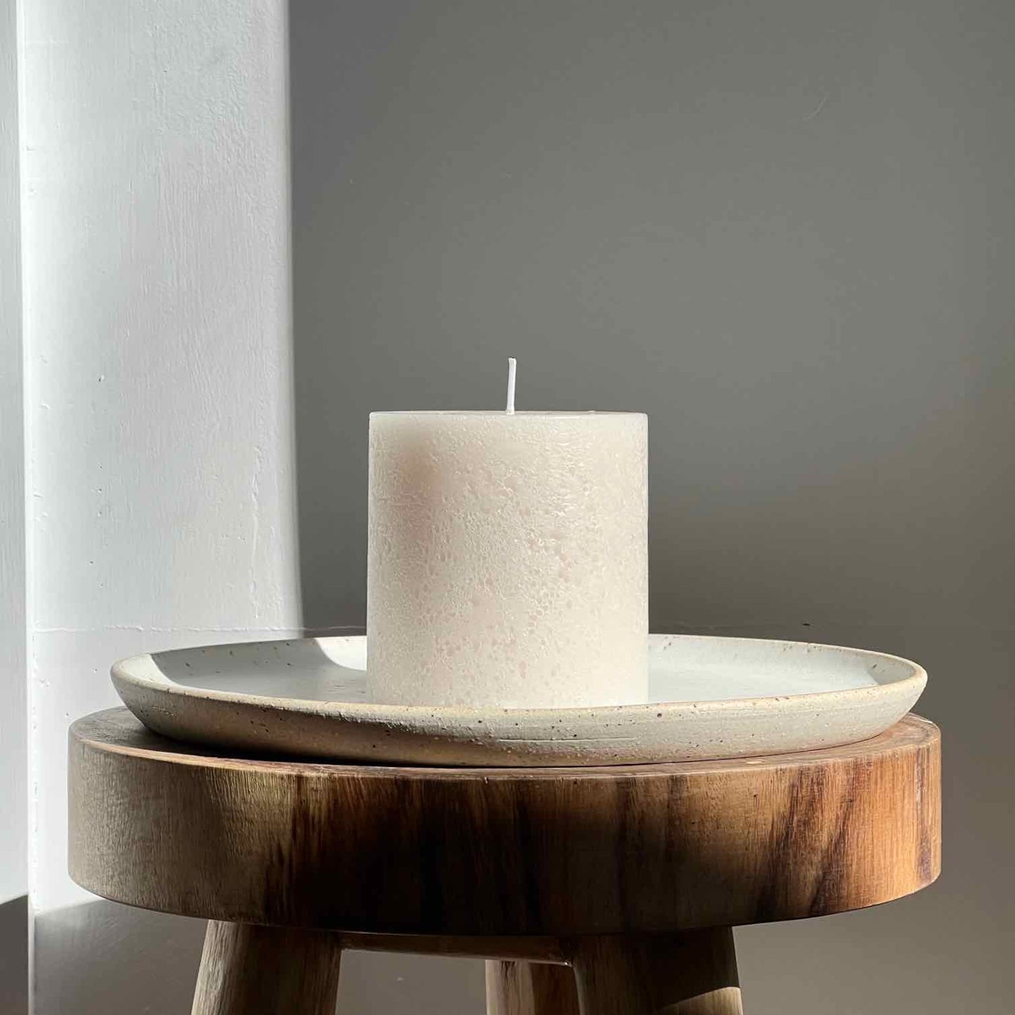 Neutral stone textured pillar candle