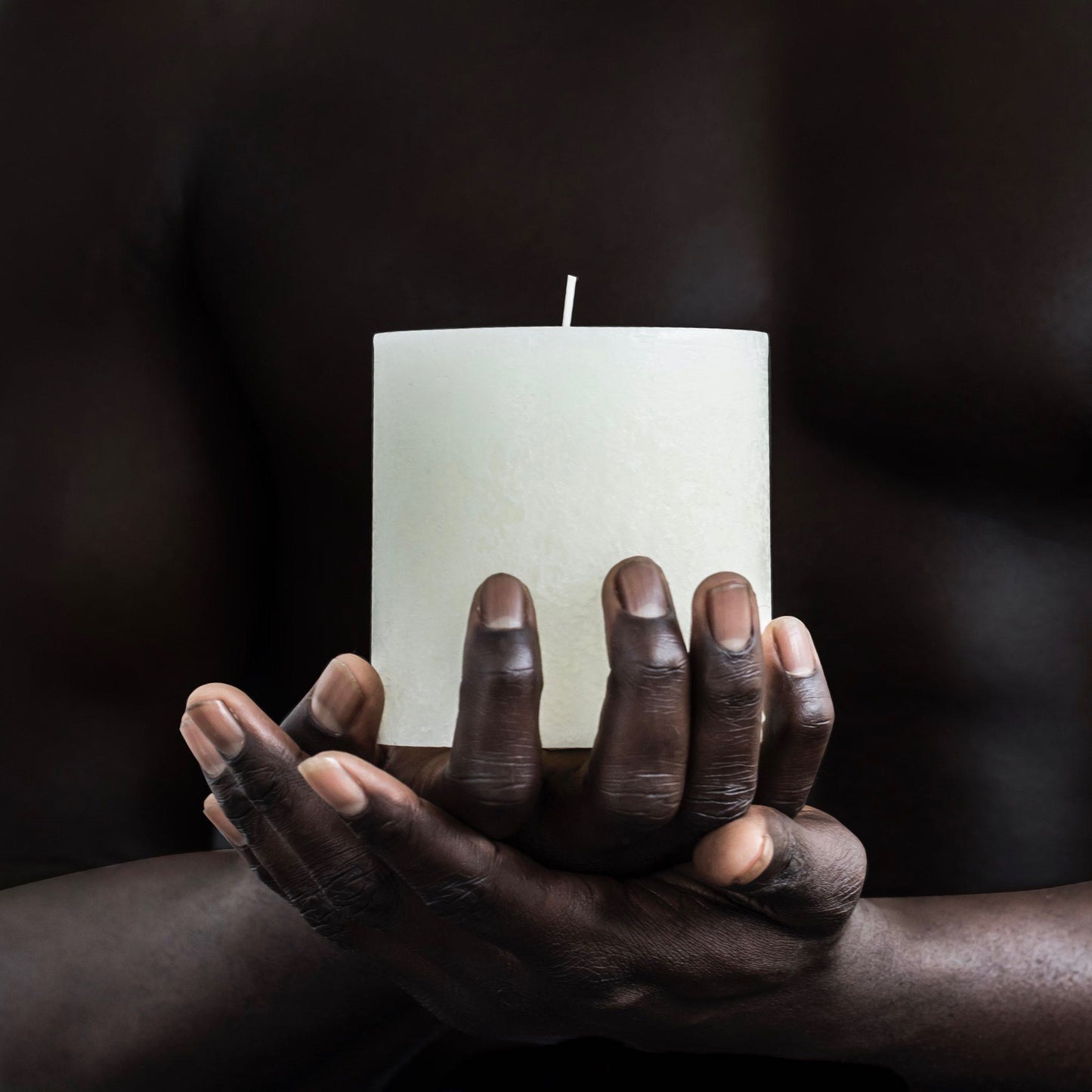 Large textured candle in warm white
