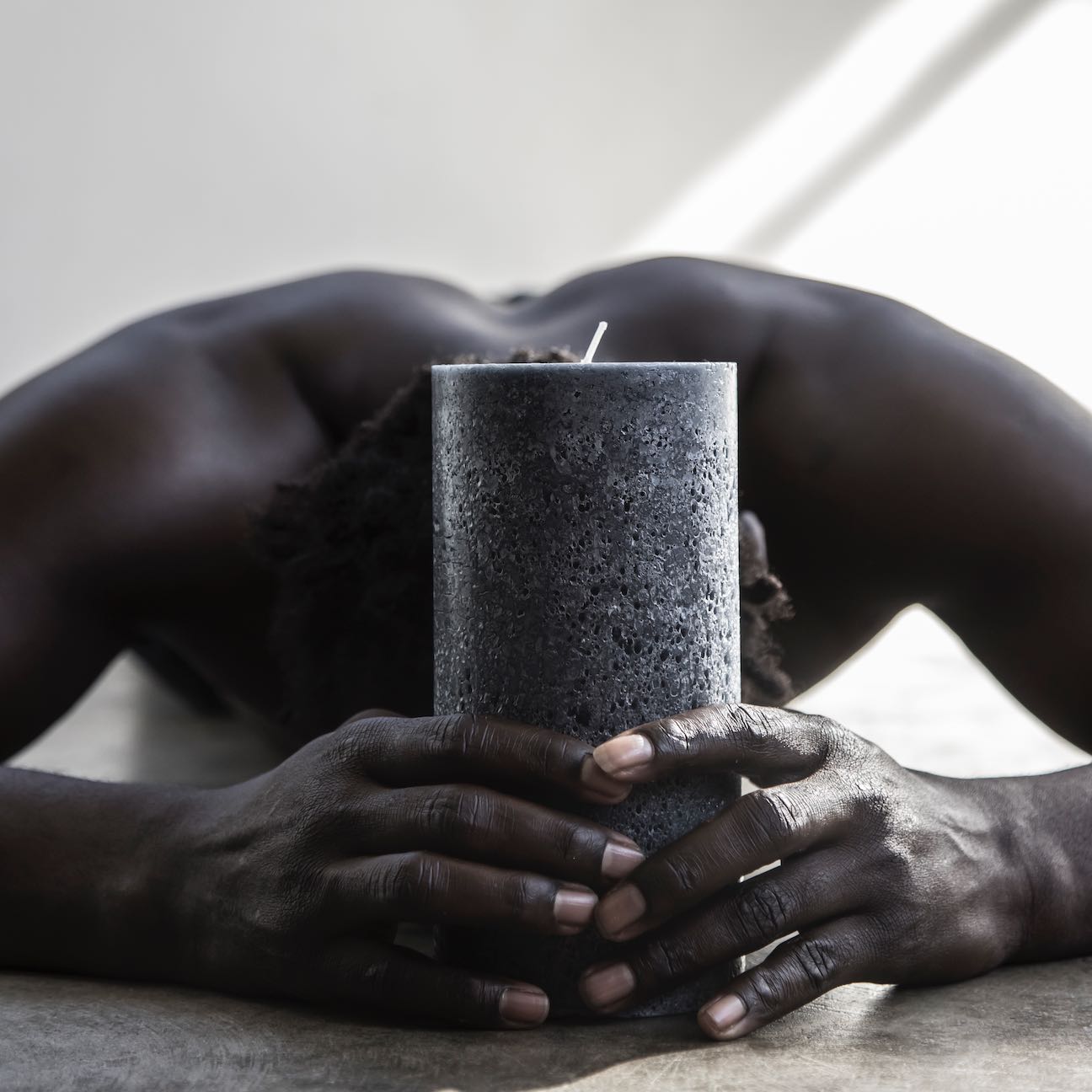 Tall charcoal textured pillar candle
