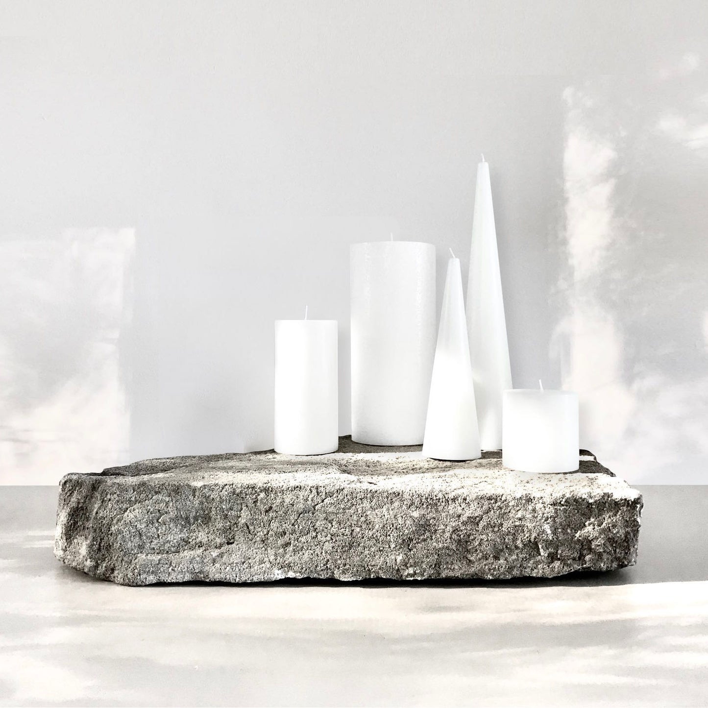 White pillar candle centrepiece