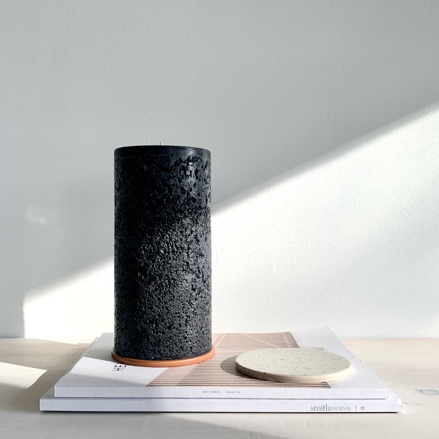 Large black textured pillar candle