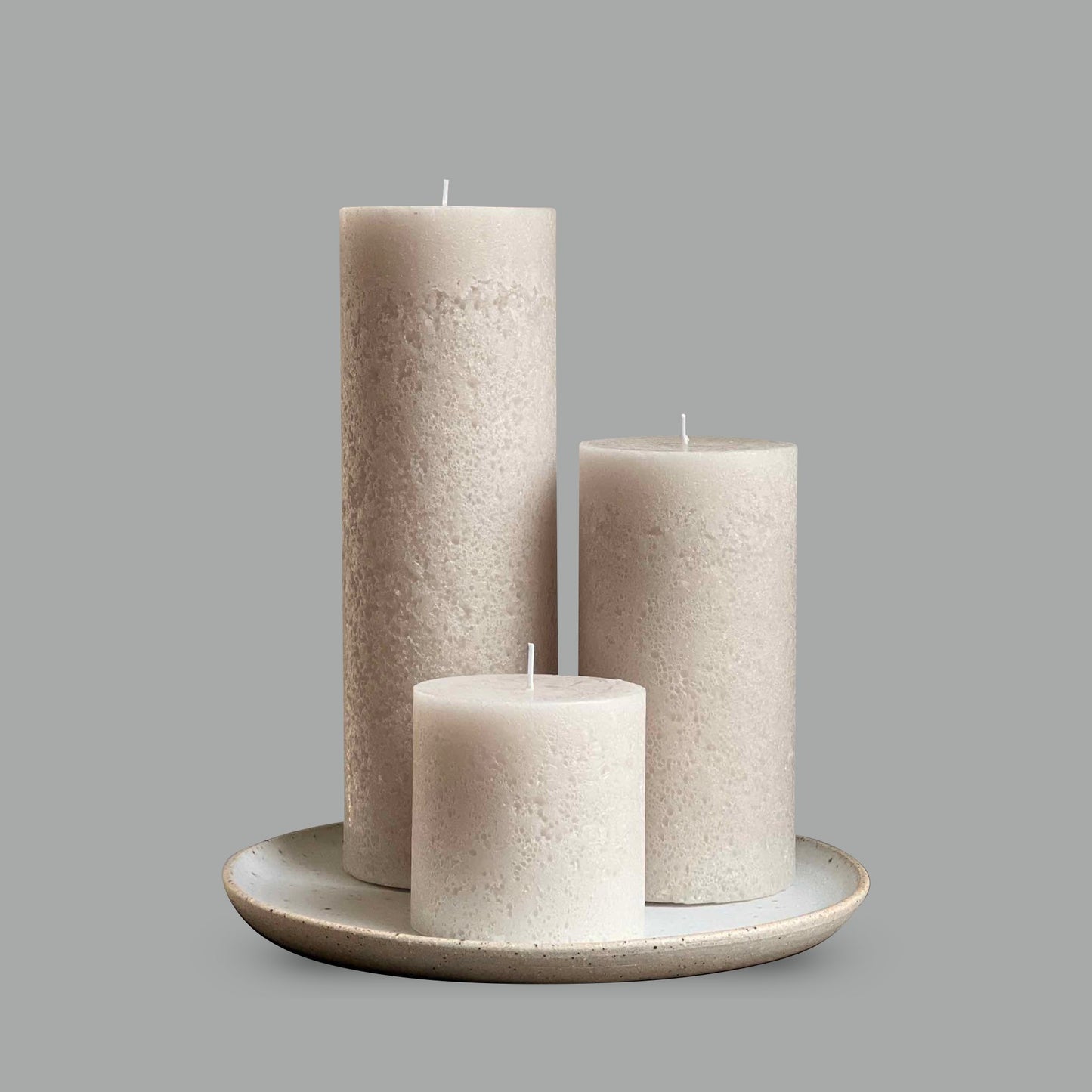 Textured pillar candle set in warm ivory