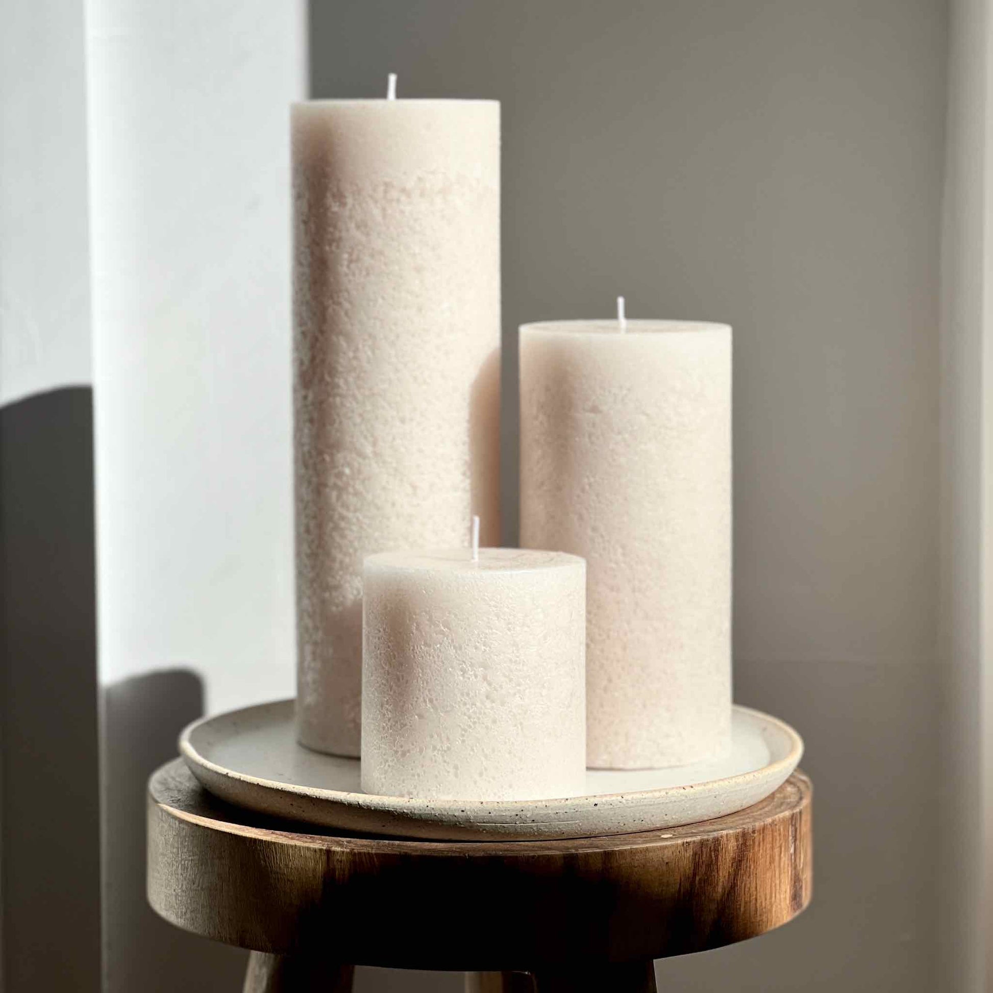 Ivory coloured textured pillar candles