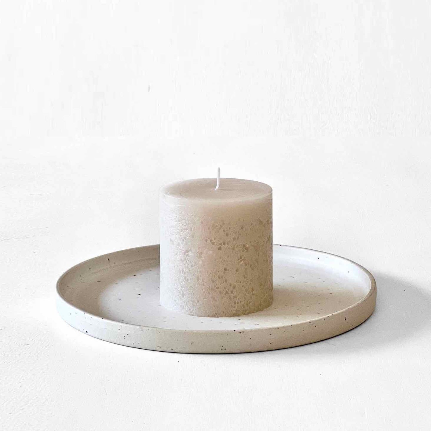 Neutral stone textured pillar candle