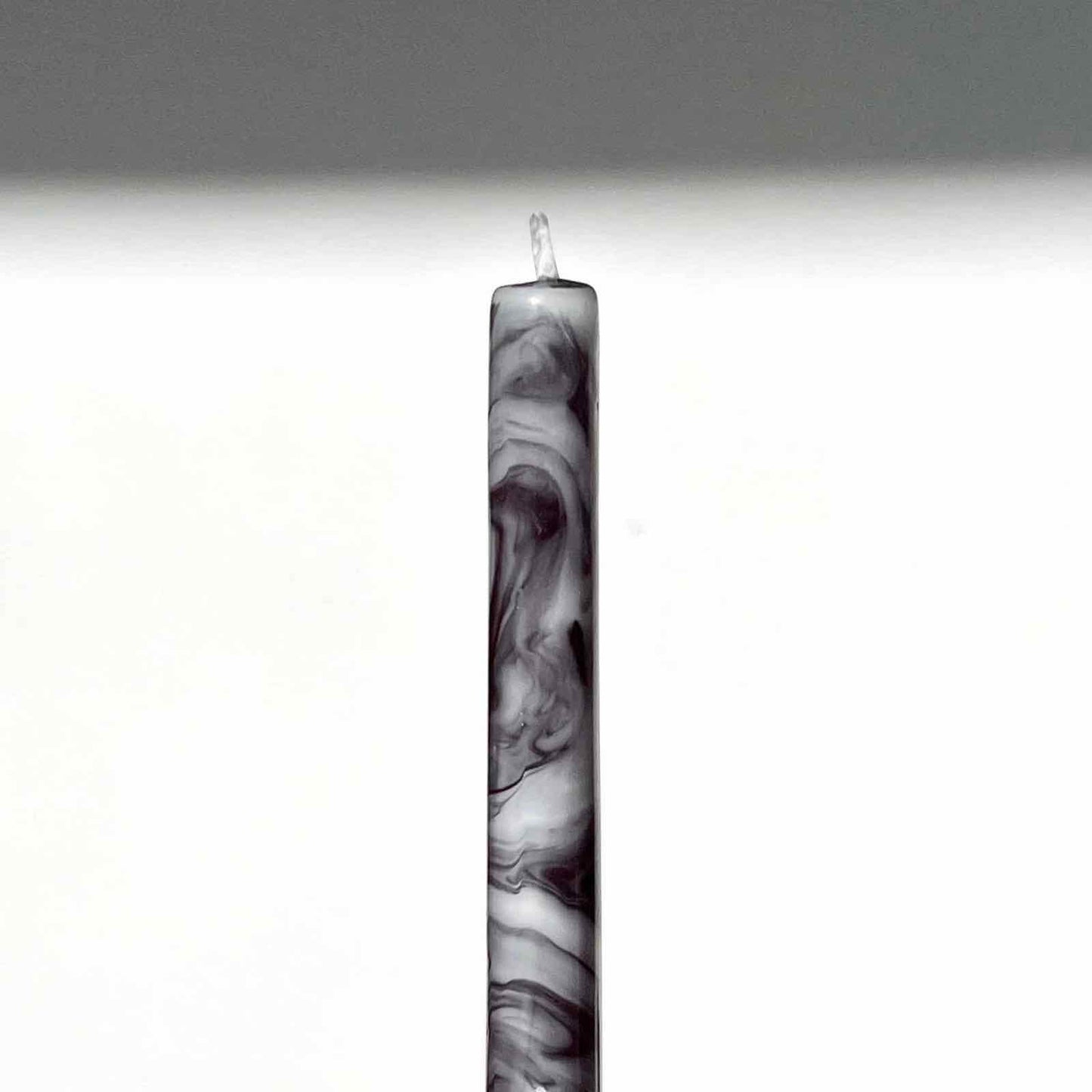 Taper candle in black and white marble