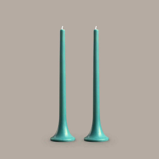 Tall taper candles in teal