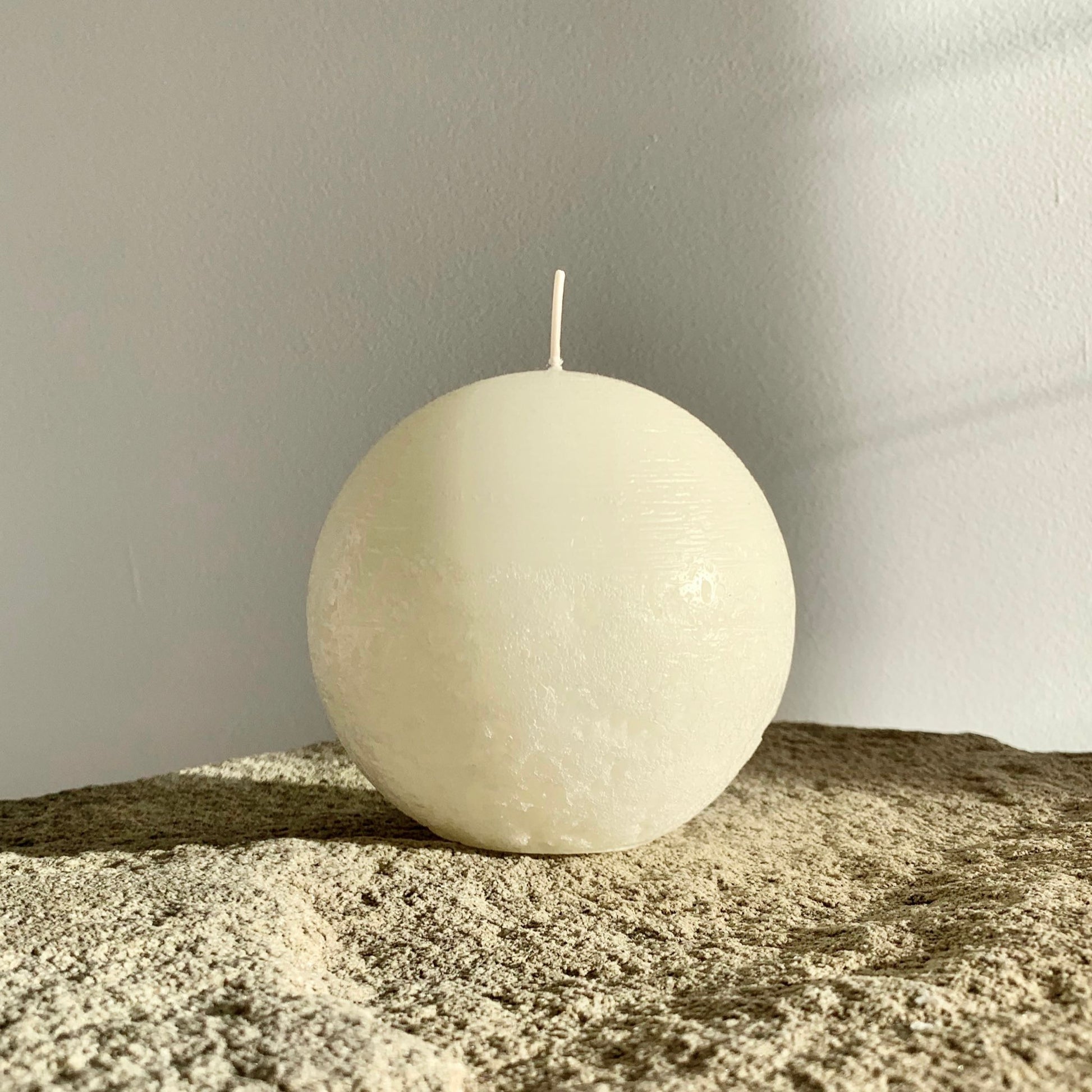 Textured white sphere candle