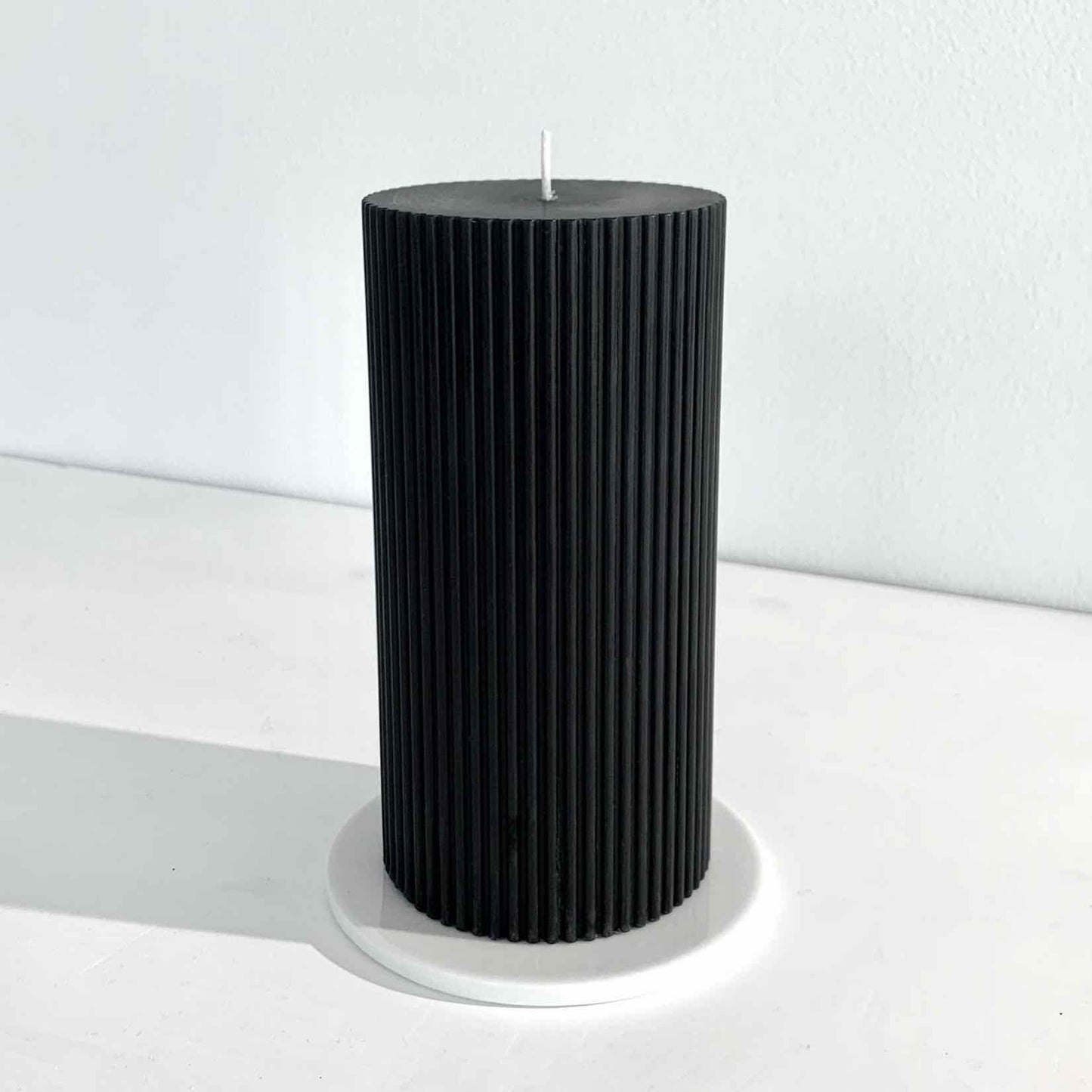 Grooved black pillar candle