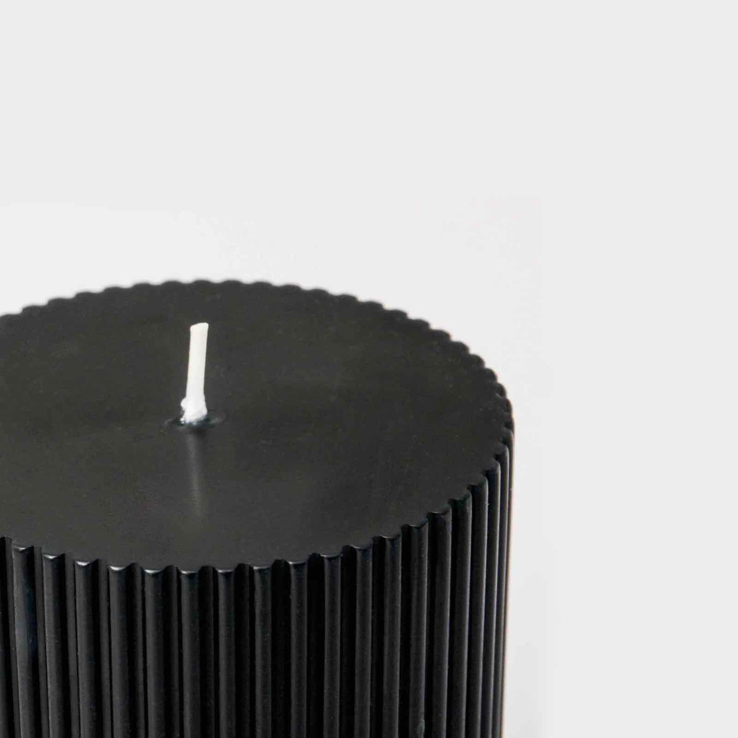 Fluted black pillar candle