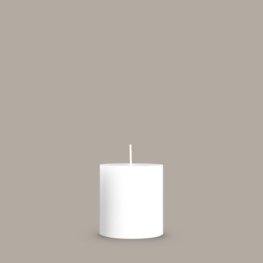 Small white pillar candle