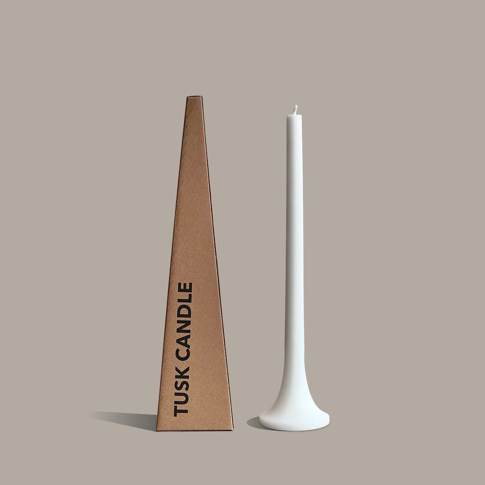 Tall white taper candle