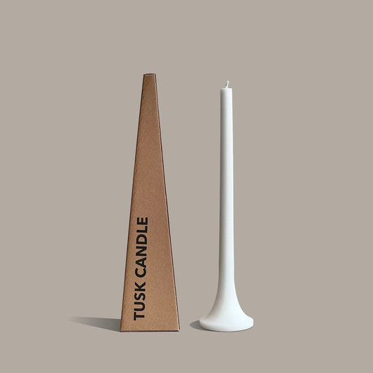 Tall white taper candle