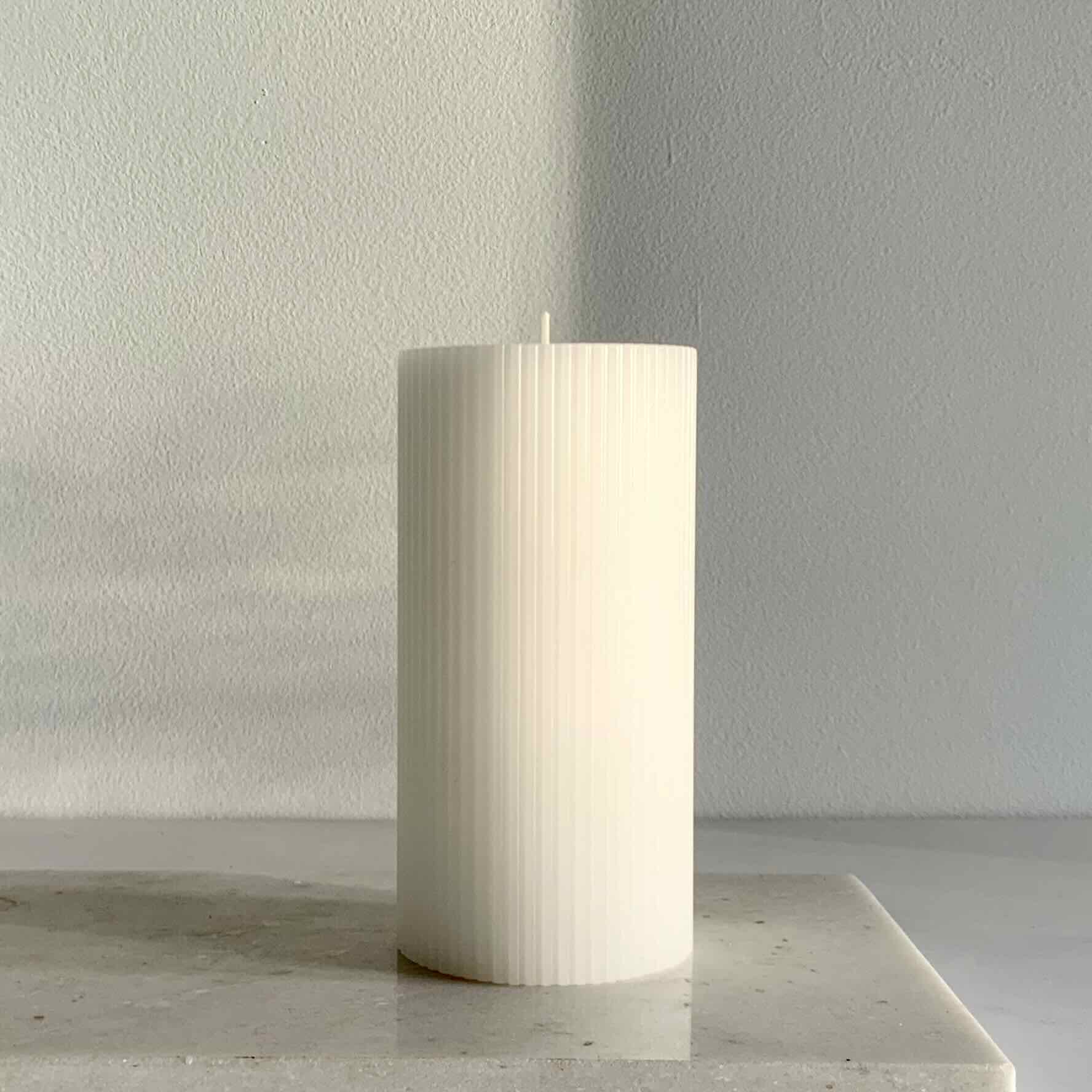 Ribbed white pillar candle