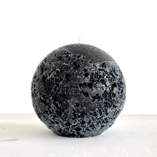Large black spherical candle