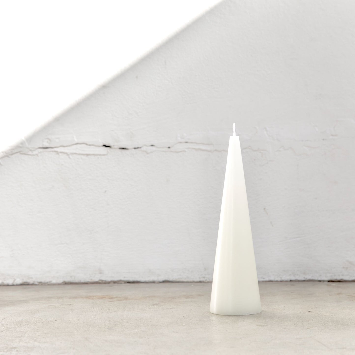 Tall white cone candle