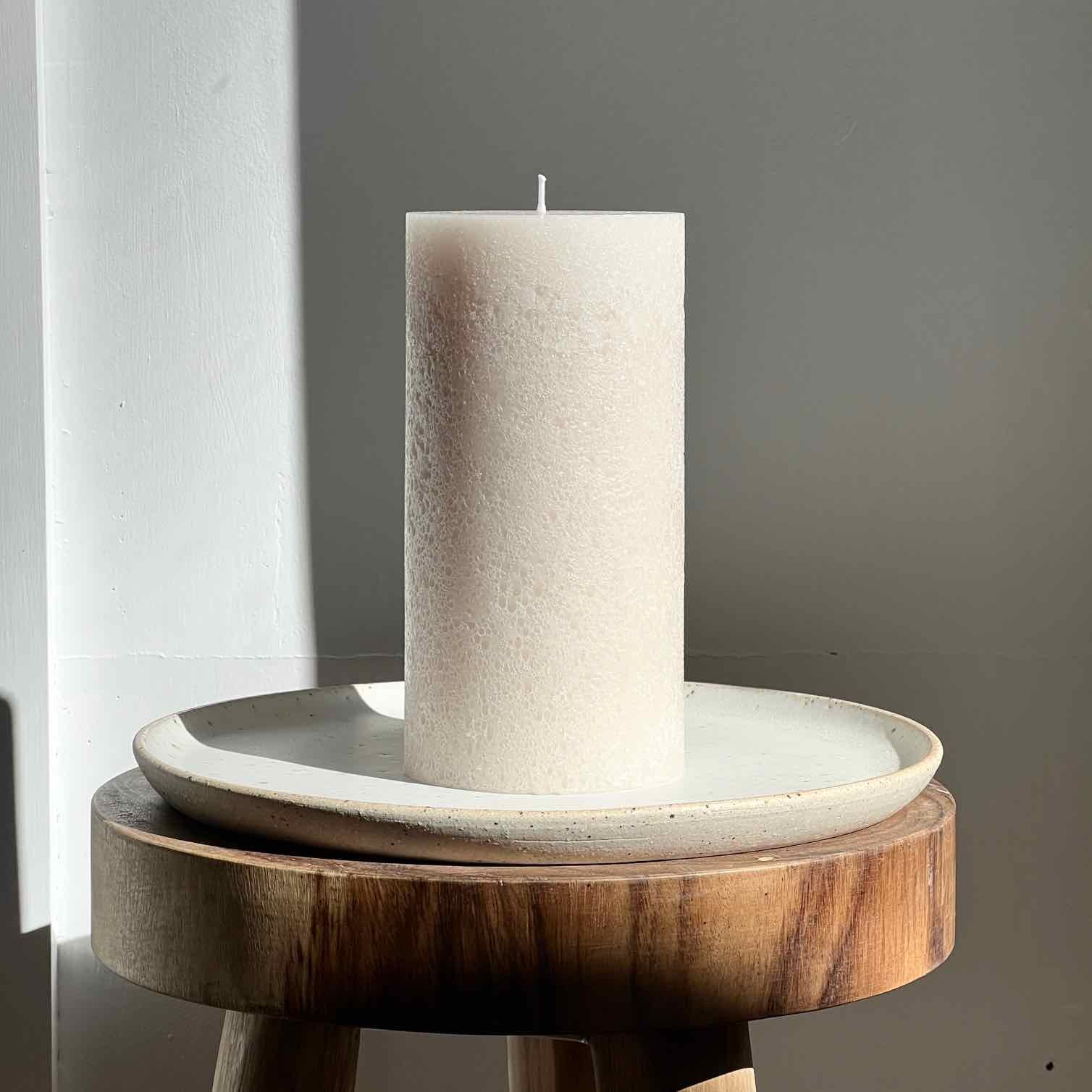 Neutral textured pillar candle