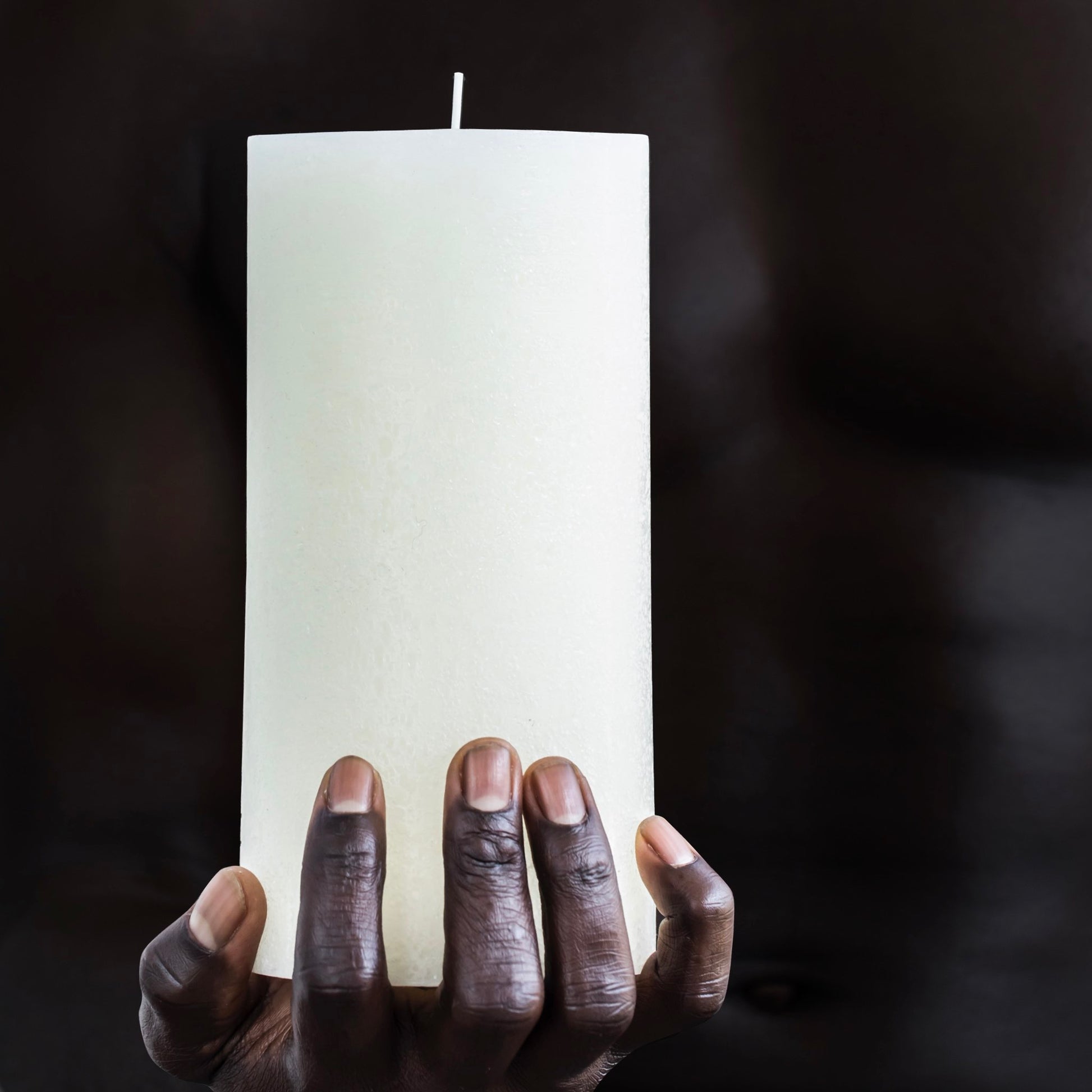 Tall white textured candle