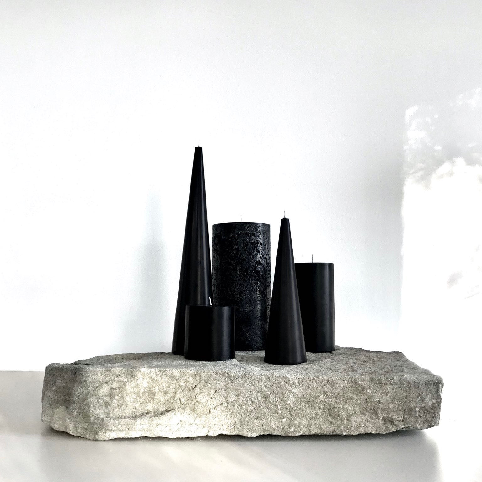 Sculptural black pillar candles