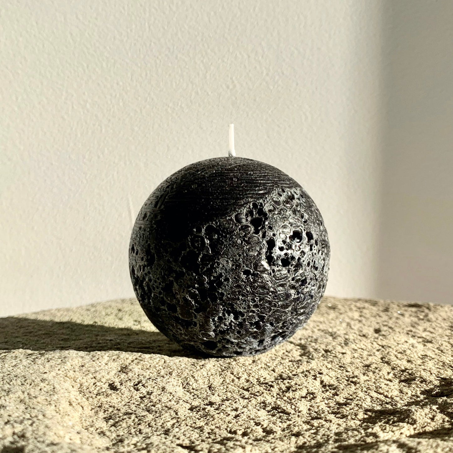 Textured black ball candle