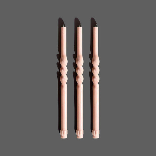 Taper candles in a neutral clay colour