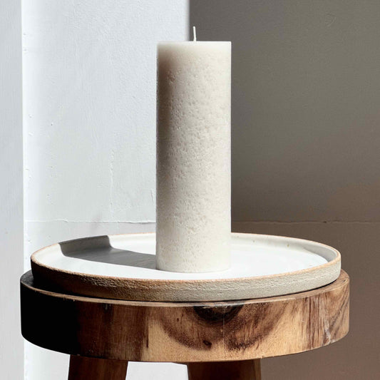 Rustic pillar candle in neutral stone colour