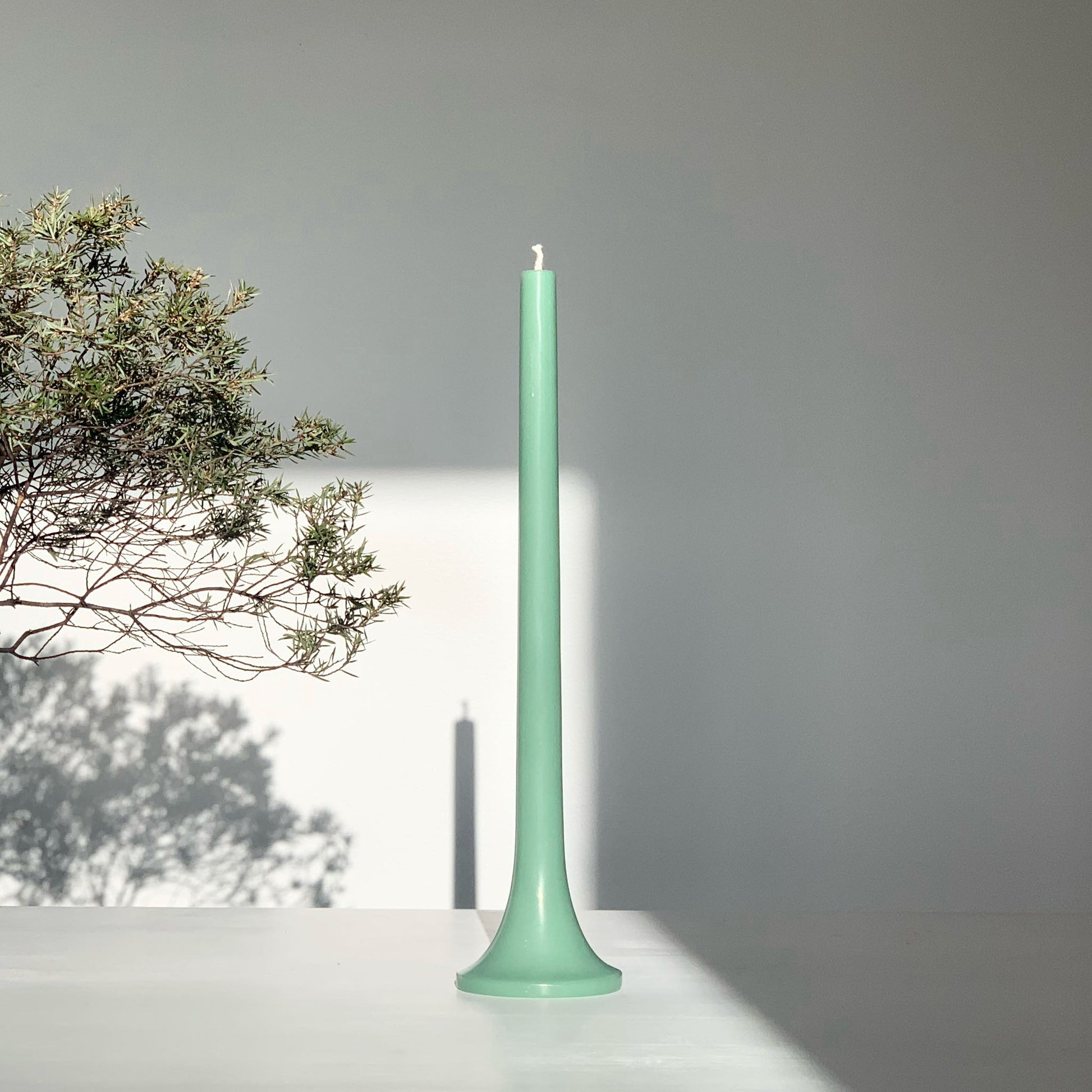 Modern green taper candle