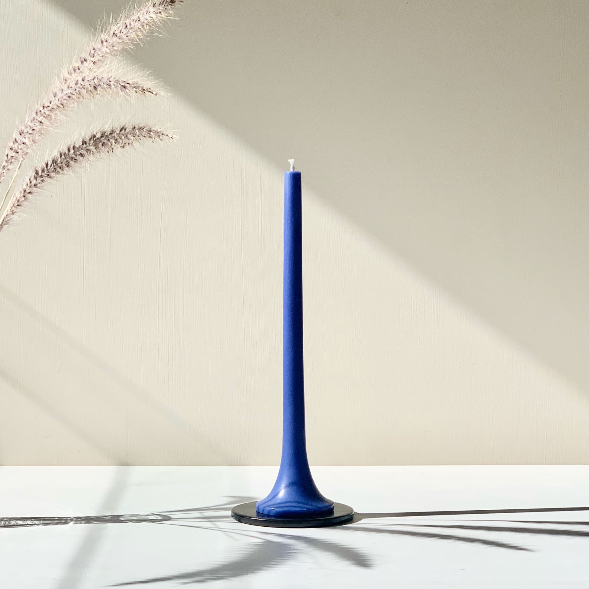 Stylish blue taper candle