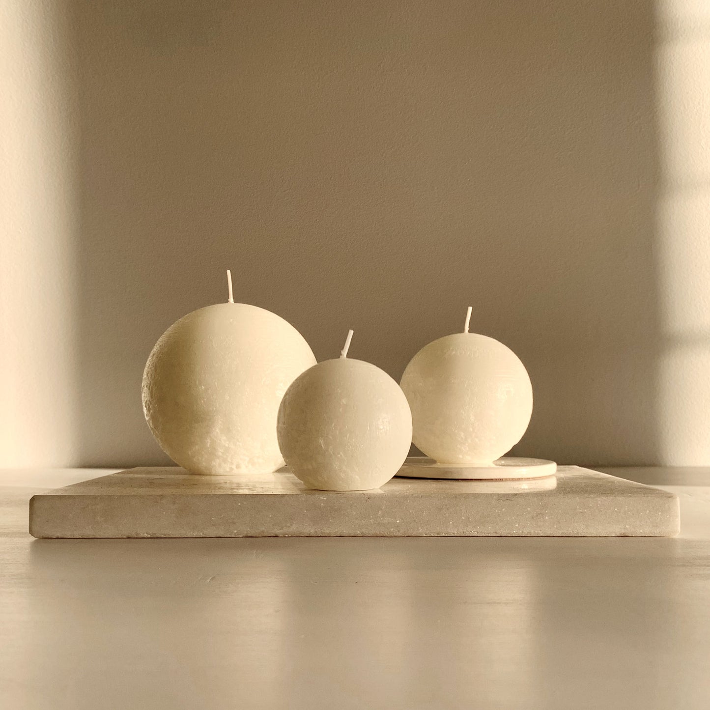 White rustic spherical candles